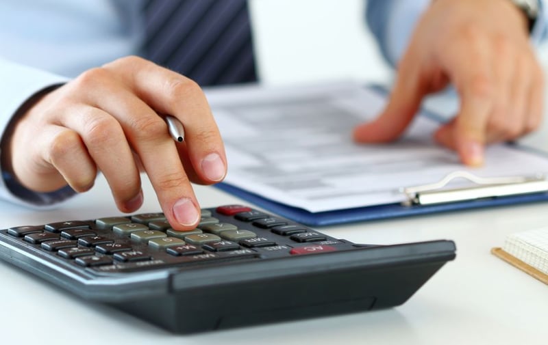 Person using calculator 