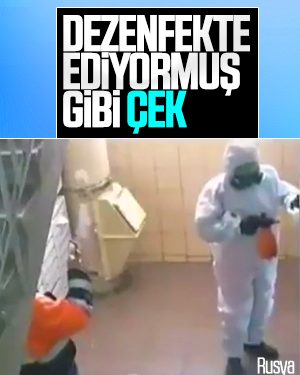 Rusya’da ‘dezenfekte ediyormuş gibi’ yapan görevliler